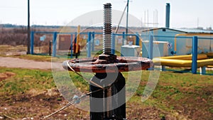 Oil and gas industry. Valve with a pipeline close-up. Production, processing and storage of raw materials. Oil refinery