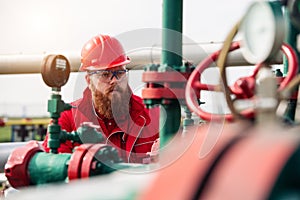 Oil and Gas Industry Worker. Engineer working on pipeline equipment for oil and gas company.