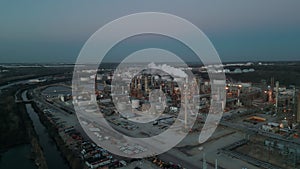 Oil and gas petrol fuel chemical tank with oil refinery petrochemical plant at twilight, Aerial wide view