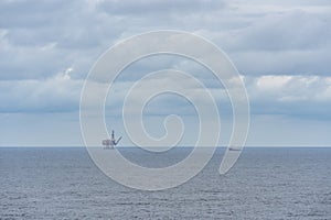 Oil or gas platform and a ship in the sea