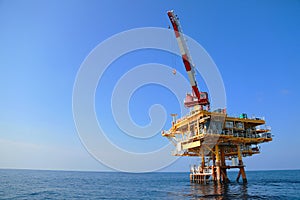 Oil and gas platform standing in the gulf or offshore and operation by technician.