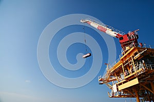 Oil and gas platform standing in the gulf or offshore and operation by technician.