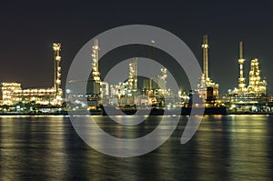 Oil and gas refinery at night time - Petrochemical factory