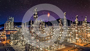 Oil and gas refinery plant form industry zone at night sky  with star, Aerial view oil and gas Industrial petrochemical fuel power
