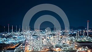 Oil and gas refinery plant or petrochemical industry at night sky, Manufacturing of petroleum industrial business aerial view