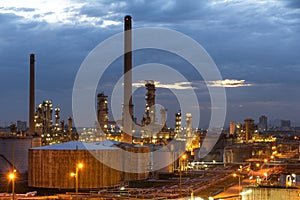 Oil and gas refinery plant or petrochemical industry on sky sunset background, Factory with evening, Gas storage sphere tank in