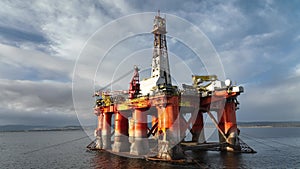 Oil and Gas Rigs Seen up Close at Sunset