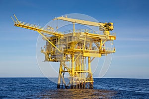 Oil and gas wellhead remote platform produced raw gas and oil then sent to central processing platform photo