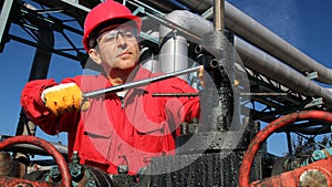 Oil and Gas Worker in Action Inside Refinery