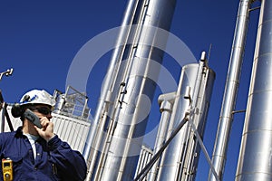 Oil and gas worker with large gas pipelines