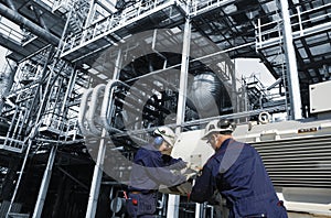 Oil and gas workers inside refinery