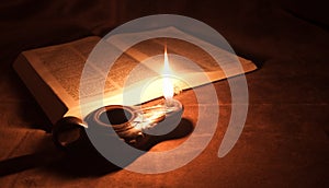 Oil lamp and Bible photo