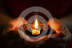 Oil lamp in hands