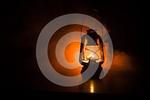 Oil Lamp Lighting up the Darkness or Burning kerosene lamp background, concept lighting. Selective focus