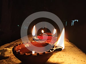 An oil lamp lit as an offering to hindu for worship with selective focus