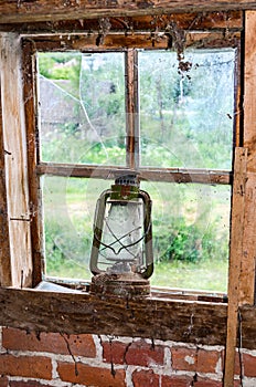 Oil Lamp on old broken window