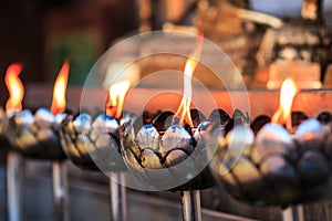 Oil lamp of the prayers at the temple