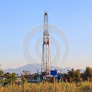 Oil Land Drilling Rig Working In The Field