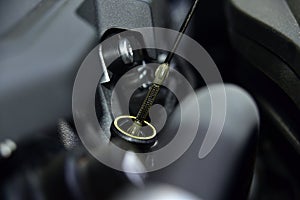 Oil level control rod in a car engine