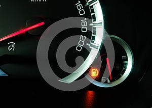 Oil level gauge show icon low fuel warning on car dashboard