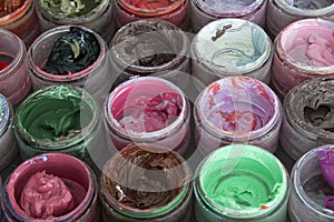 Oil paint in round containers