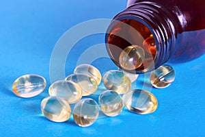 Oil pills spilling out of prescription bottle