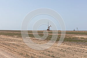 Oil platform, oil derricks in Kazakhstan steppes
