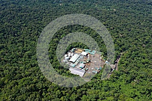 An oil platform surrounded by forest located on top of an oil field in the tropical forest in South America