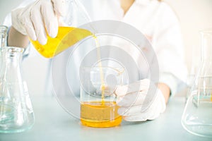 Oil pouring, Formulating the chemical for medicine,Laboratory research, dropping liquid to test tube