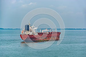 Oil product tanker in ballast anchored in outer harbor in front of the Pengerang Deepwater Petroleum Terminal. Johor, Malaysya