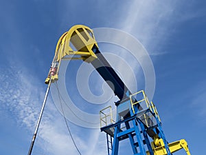 Oil pump against the blue sky