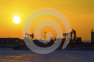 Oil pump against setting sun