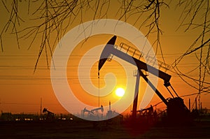 Oil pump against setting sun