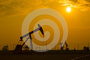 Oil pump against setting sun