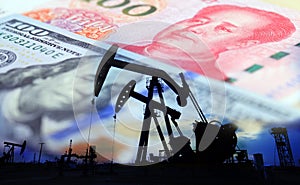 Oil pump on background of US dollar and RMB