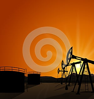 Oil pump jack for petroleum and reserve tanks on sunrise background