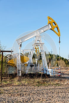 Oil pump rig. Oil and gas production. Oilfield site. Pump Jack are running. Drilling derricks for fossil fuels output