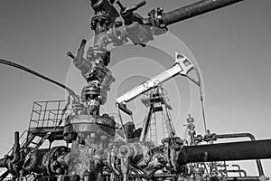 Oil pump rig. Oil and gas production. Oilfield site. Pump Jack are running. Drilling derricks for fossil fuels output