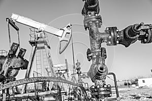 Oil pump rig. Oil and gas production. Oilfield site. Pump Jack are running. Drilling derricks for fossil fuels output