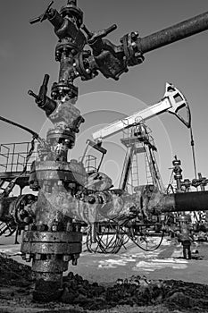 Oil pump rig. Oil and gas production. Oilfield site. Pump Jack are running. Drilling derricks for fossil fuels output