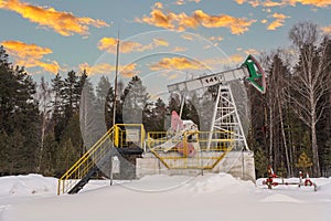 Oil pump rig. Oil and gas production. Oilfield site. Pump Jack are running. Drilling derricks for fossil fuels output and crude