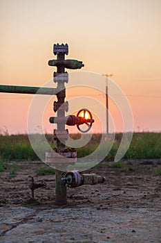 Oil pump valve at sunset