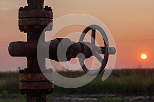 Oil pump valve at sunset