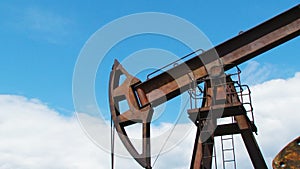 Oil Pump Working While Producing Natural Gas At