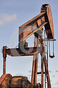 Oil pumping machine. Pump jack. Petroleum extraction. Global warming