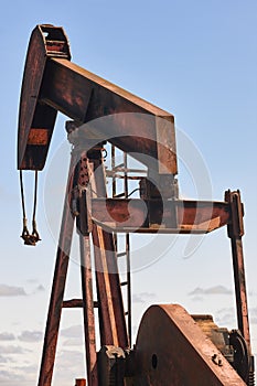 Oil pumping machine. Pump jack. Petroleum extraction. Global warming