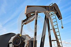 Oil pumping machine. Pump jack. Petroleum extraction. Global warming