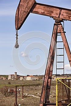 Oil pumping machine. Pump jack. Petroleum extraction. Global warming