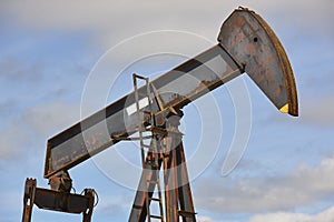 Oil pumping machine. Pump jack. Petroleum extraction. Global warming