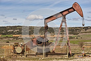 Oil pumping machine. Pump jack. Petroleum extraction. Global warming